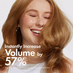 BONDIBOOST Thickening Spray being applied for even distribution on hair.