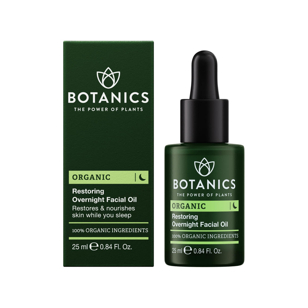Botanics Restoring Overnight Face Oil bottle on nightstand showing overnight hydration potential