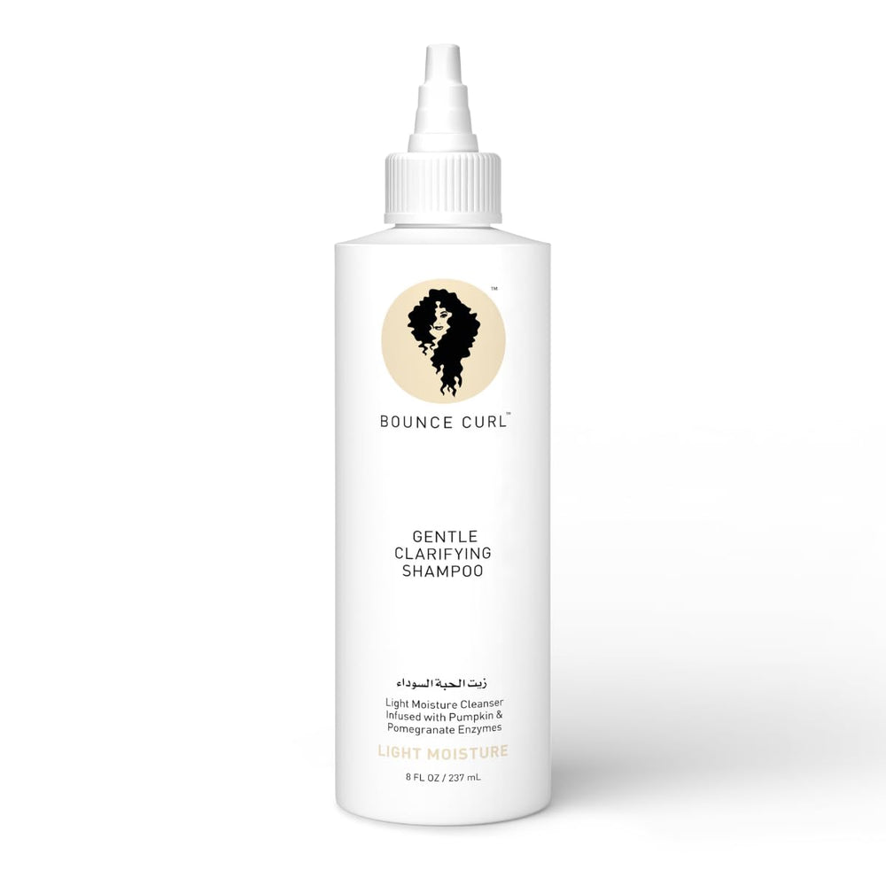 Bounce Curl Enzyme Gentle Clarifying Shampoo bottle pour shows balanced moisture.