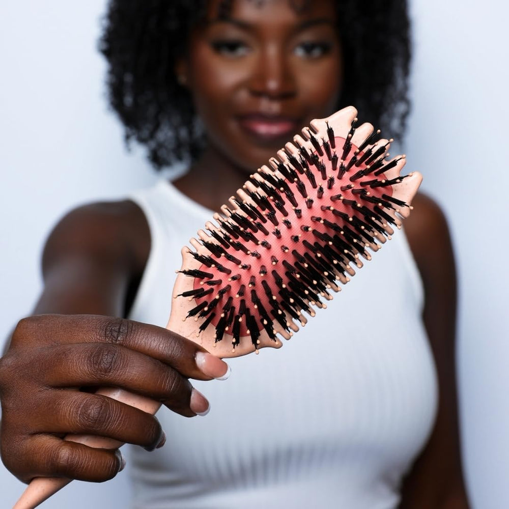 Bounce Curl Volume EdgeLift Brush vegan bristles reducing frizz and enhancing lift.