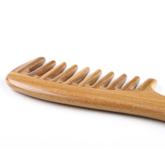 Breezelike sandalwood comb releasing fragrance during styling for calming effect