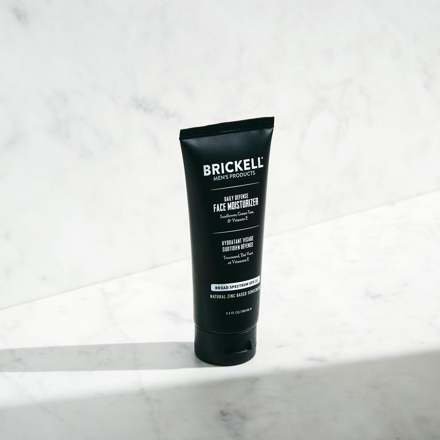 Brickell Daily Defense SPF20 face application shows quick-absorb texture for daily use