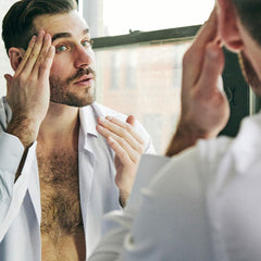 Brickell Men’s Serum peptides close-up emphasizing firming support for revived skin.