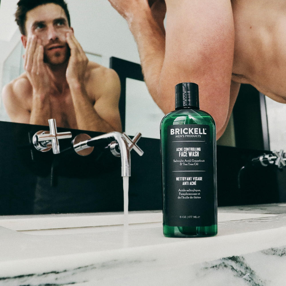 Brickell Men's Acne Face Wash hand application showing refreshing, non-irritating cleansing experience