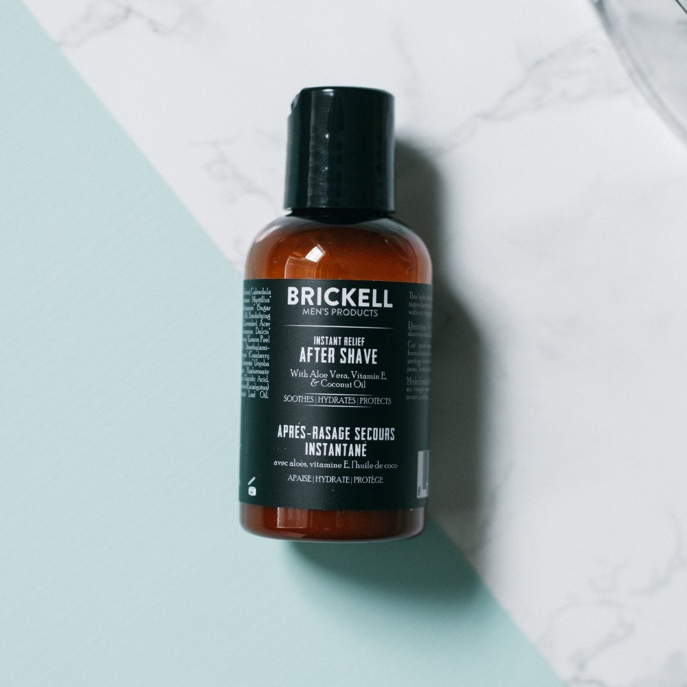 Brickell Men's aftershave bottle packaging shown, signaling travel-friendly 2-ounce size.