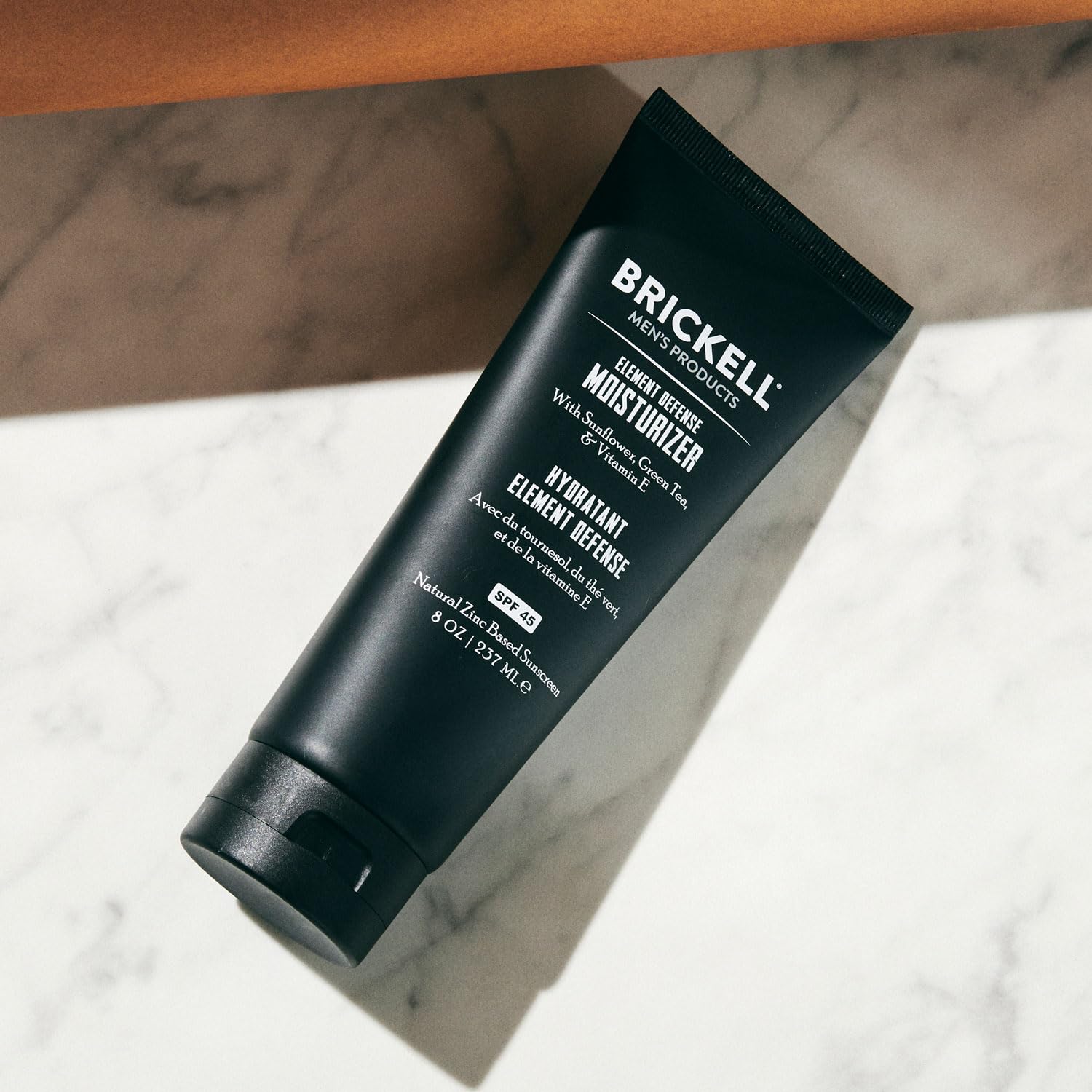 Brickell Men's Element Defense SPF45 outdoor use scene highlights sun protection.
