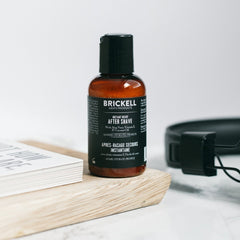 Brickell Men's Instant Relief aftershave closeup highlighting natural ingredients that calm pores.