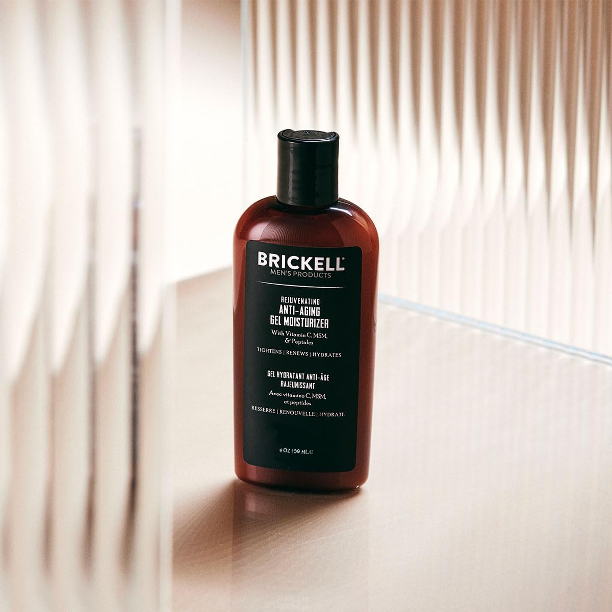 Brickell Men's Rejuvenating Gel dispense action demonstrates quick absorption in a grooming routine.