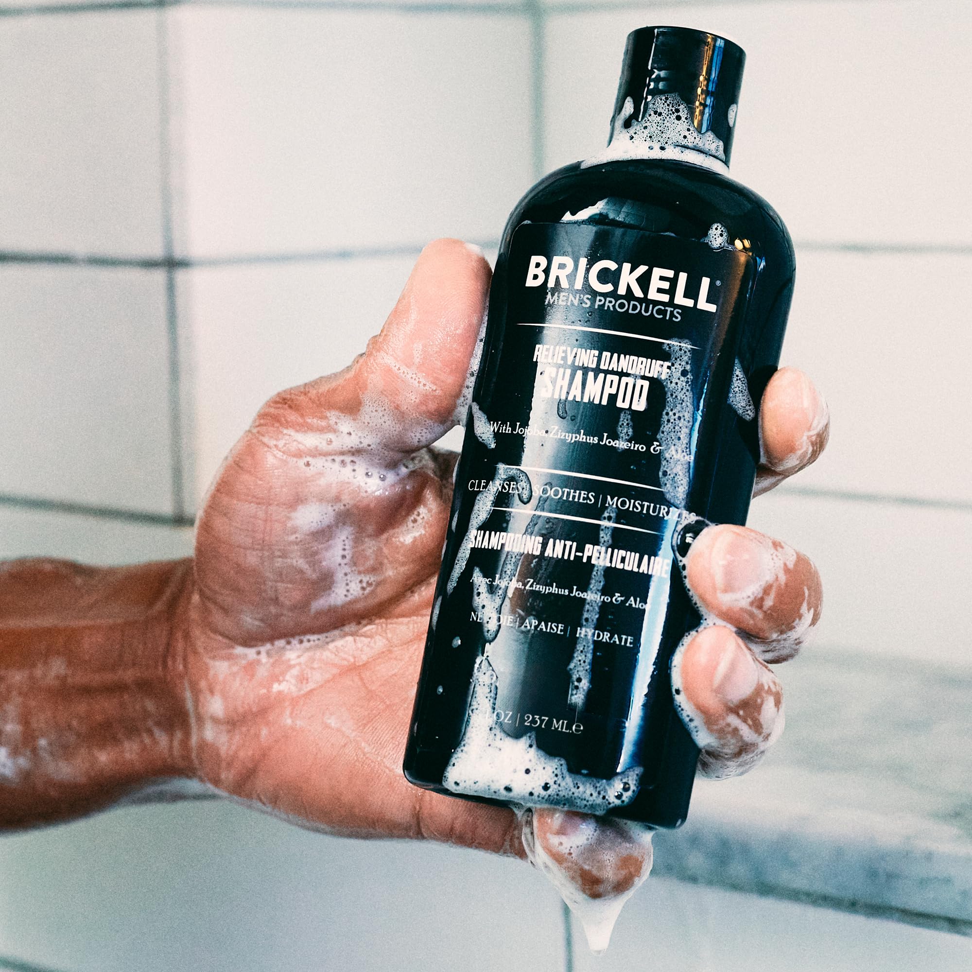 Brickell Men's Relieving Dandruff Shampoo foamy-lather demonstrates gentle cleansing for dry scalp