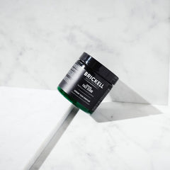 Brickell Men's Renewing Face Scrub with jojoba beads demonstrates gentle exfoliation for smoother skin.