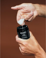 Brickell Men's Renewing Face Scrub reveals pumice particles for deeper clean.