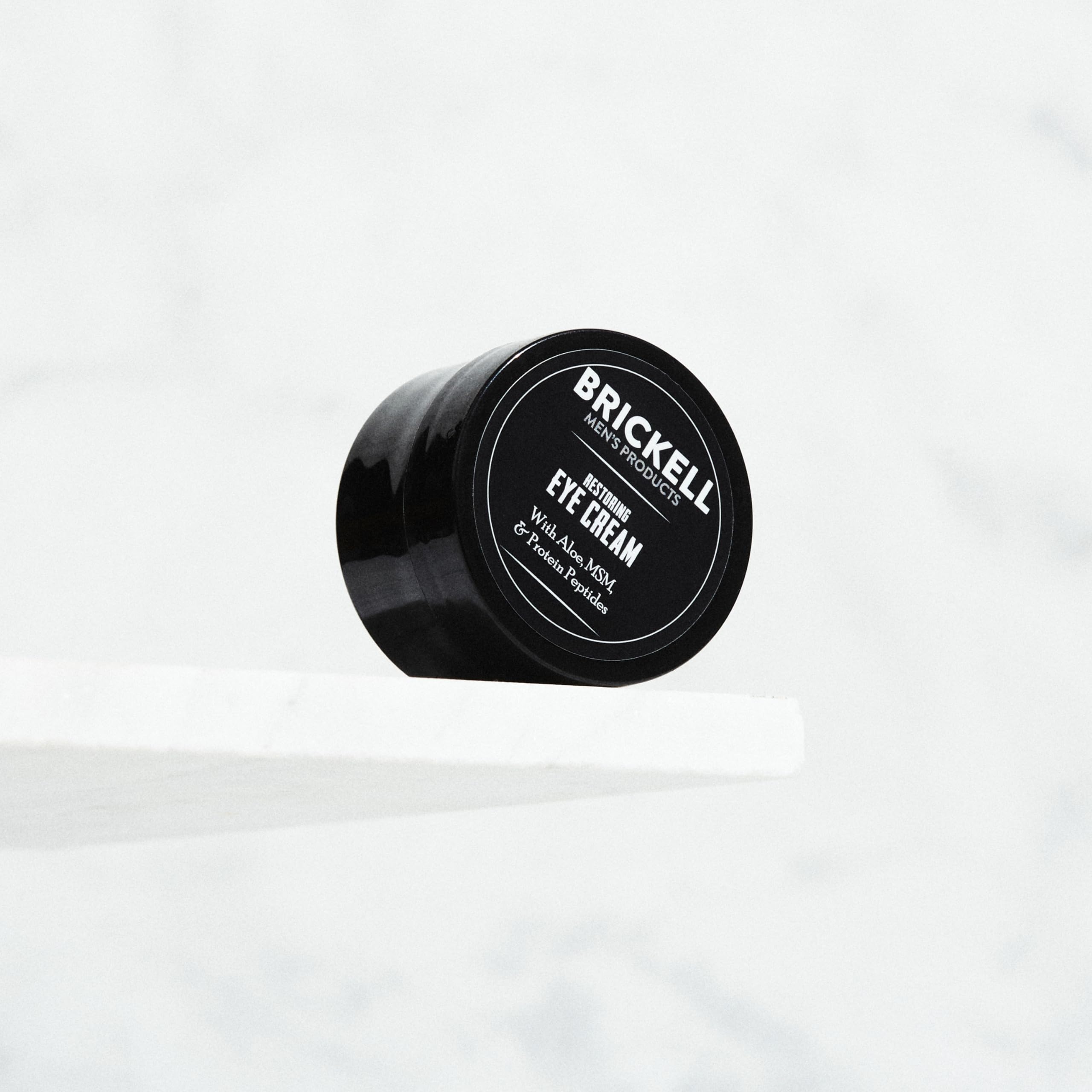 Brickell Men's Restoring Under Eye Cream ingredients highlight hyaluronic acid and vitamin C benefits.