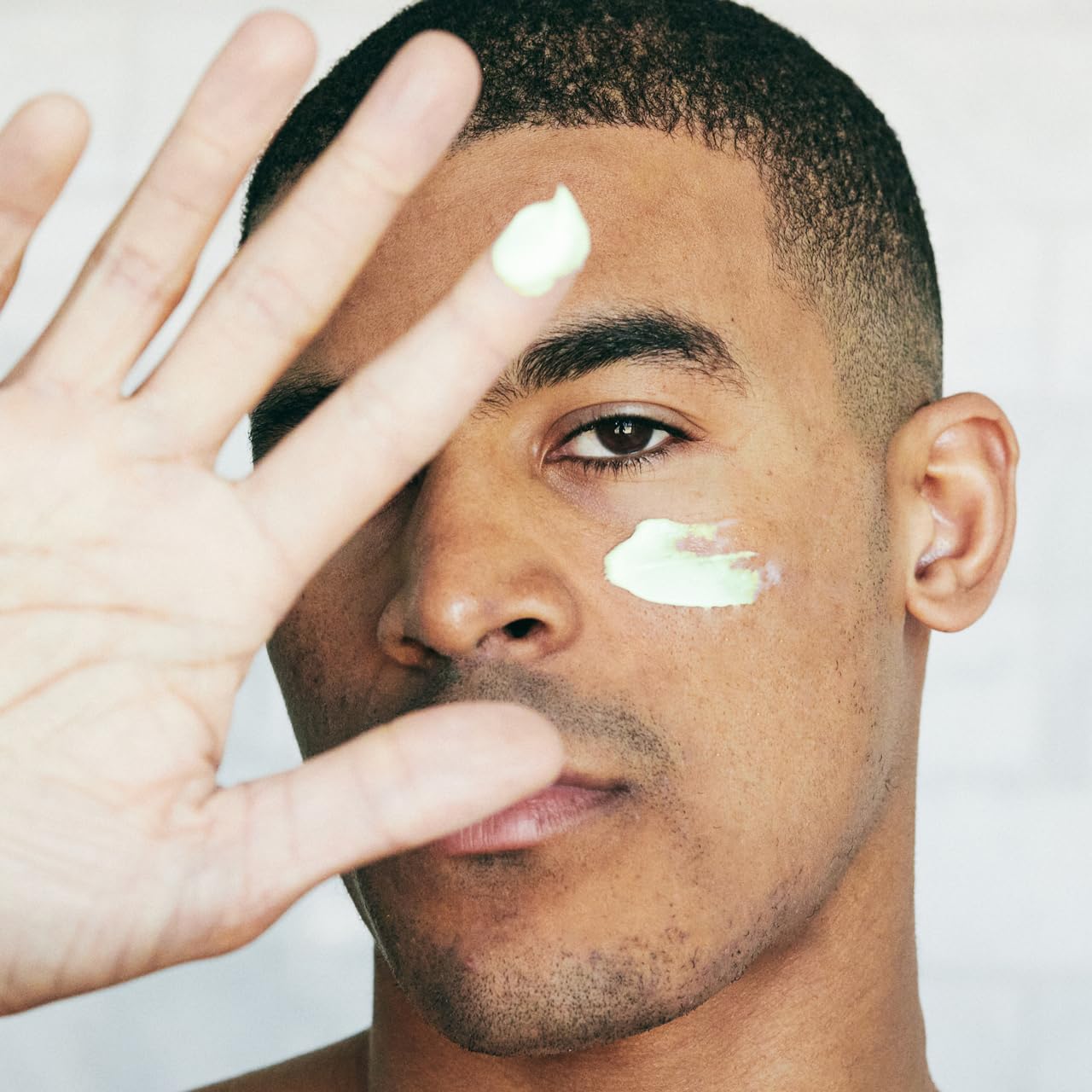 Brickell Men's Retinol Face Moisturizer during night routine showing smooth finish.