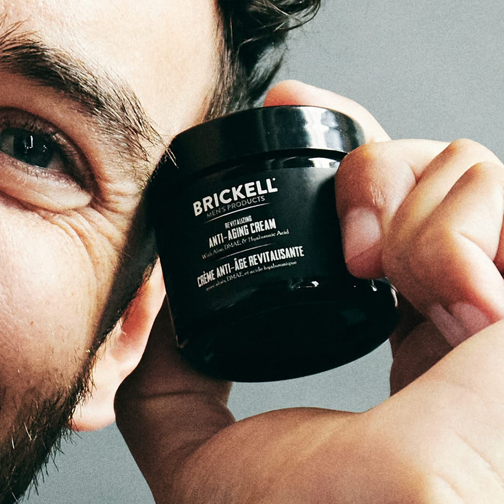 Pump dispenser of Brickell Men's Revitalizing Anti-Aging Cream releasing unscented formula