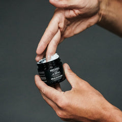 Texture close-up of Brickell Anti-Aging Cream highlights rich, hydrating formula.
