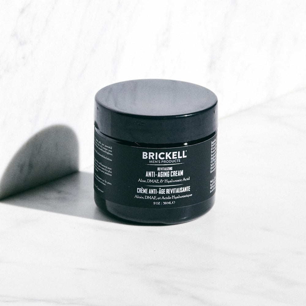 Brickell Men's Ultimate routine on man's face during nighttime ritual
