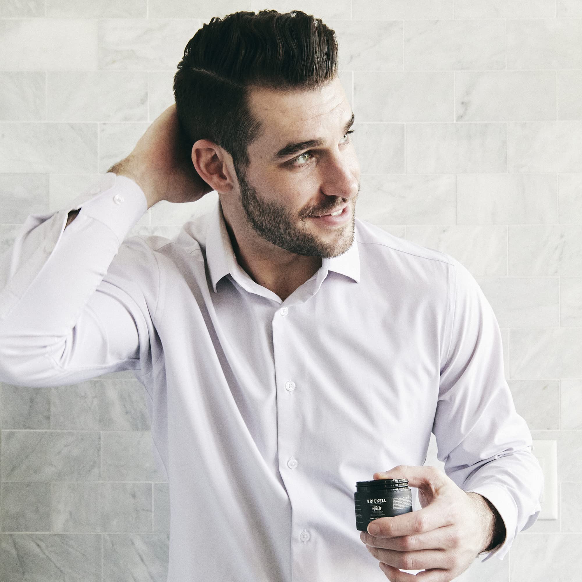 Brickell Shaping Paste Pomade ingredients close up highlights red algae and minerals.