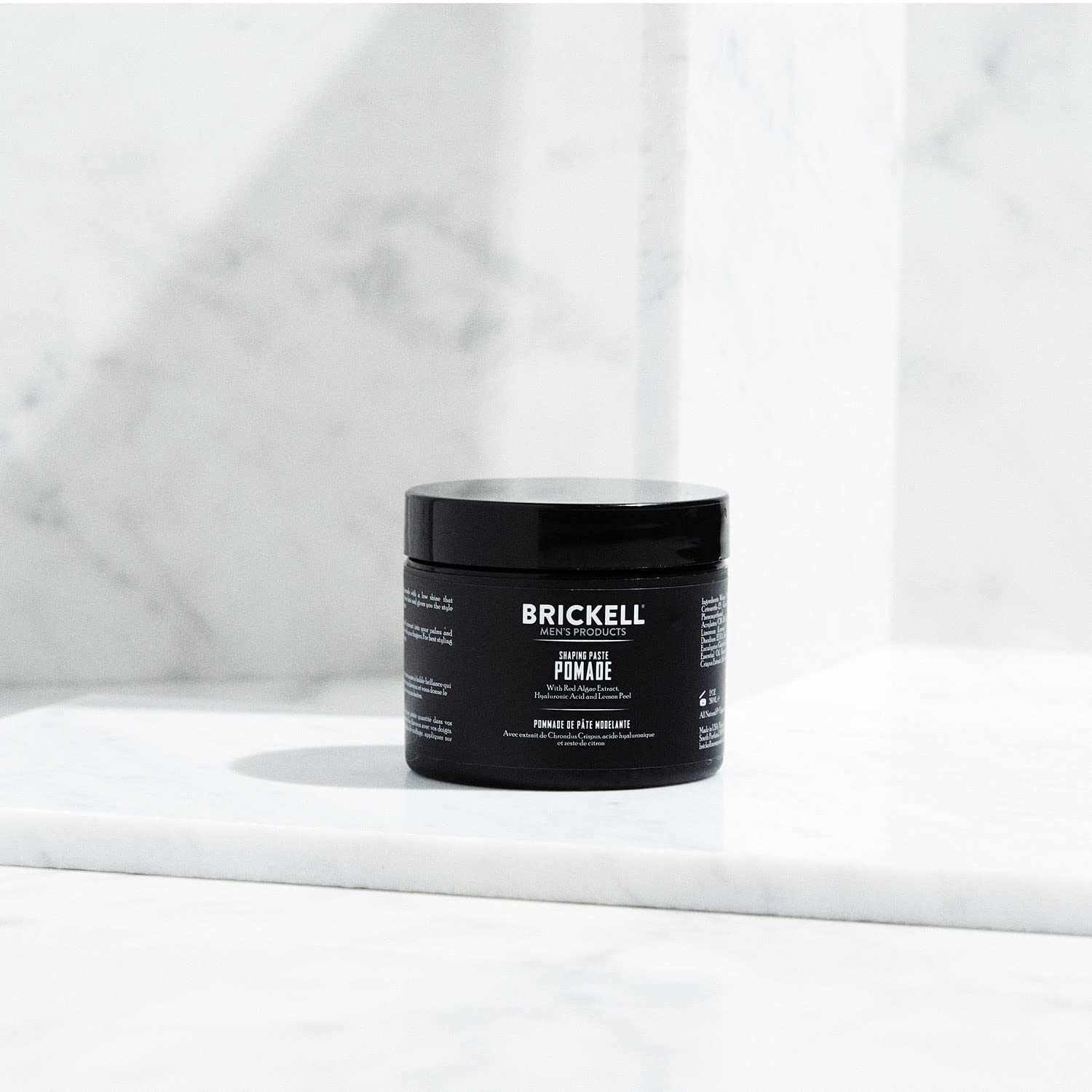 Brickell Shaping Paste Pomade textured hair close up demonstrates definition with low shine.