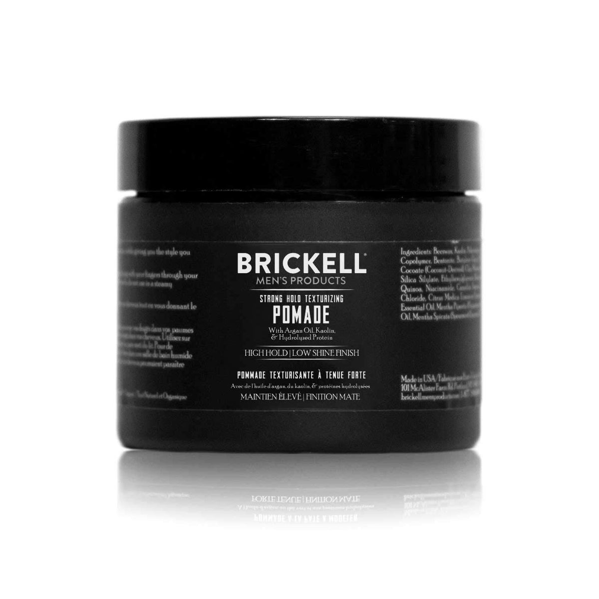 Brickell Strong Hold Pomade jar closeup highlighting texture and long-lasting hold.