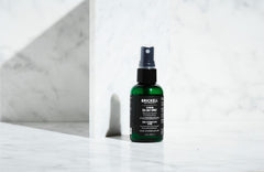 Brickell Men's Texturizing Sea Salt Spray on hair showing relaxed waves and volume.