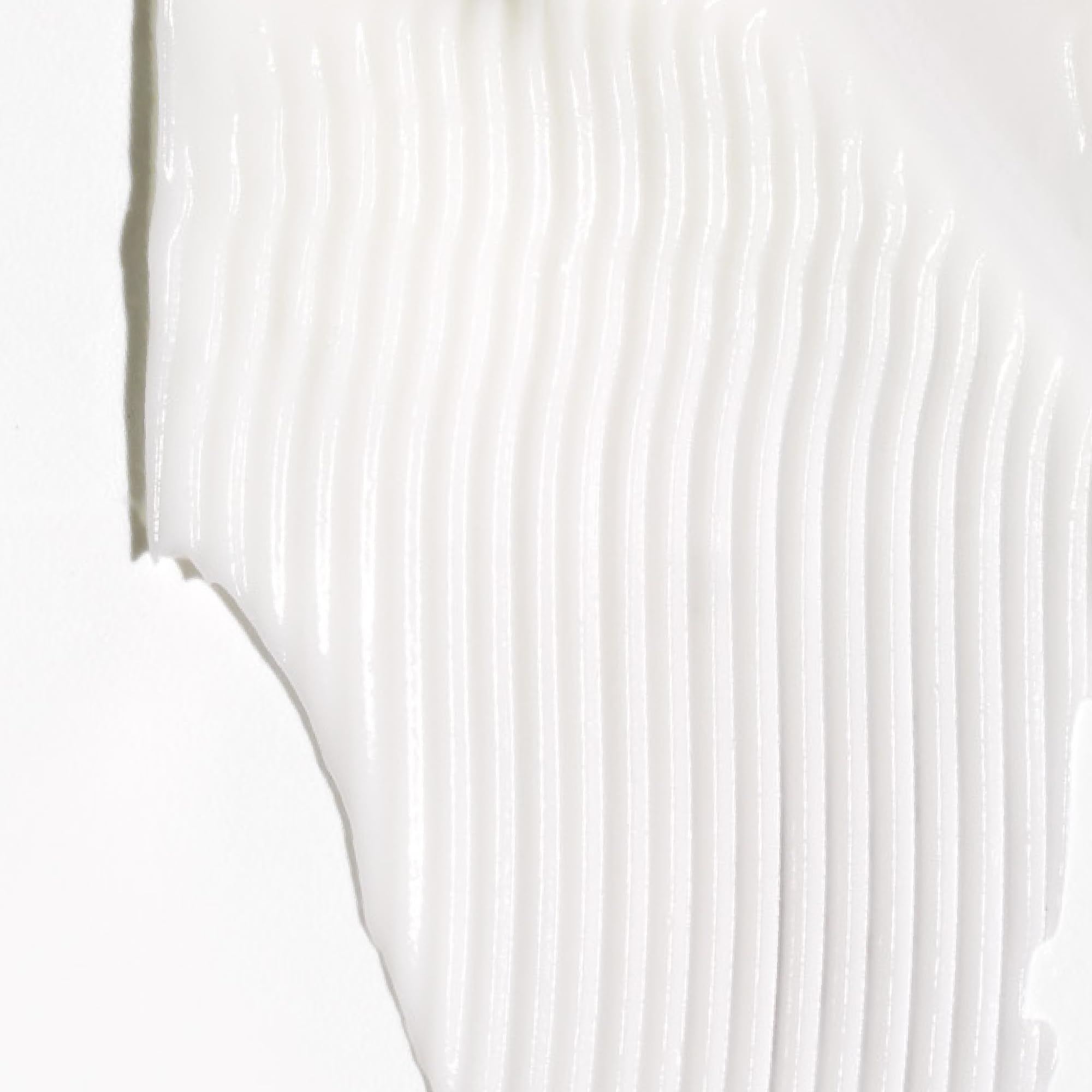 Briogeo Don't Despair, Repair! conditioner texture close-up highlights creamy moisture