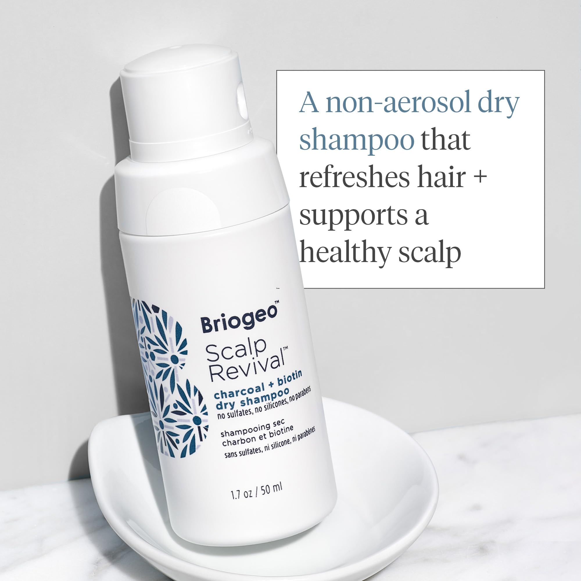 Briogeo Scalp Revival charcoal detox close-up showing impurity removal.