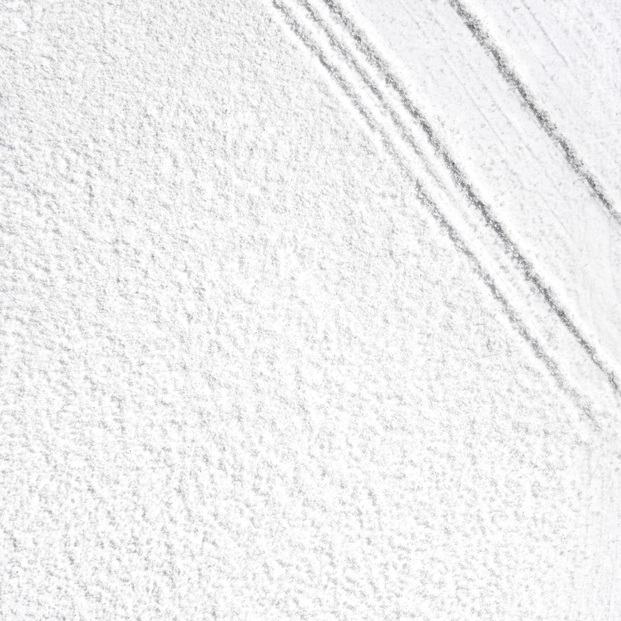 Briogeo Scalp Revival charcoal powder close-up highlights detoxifying action.