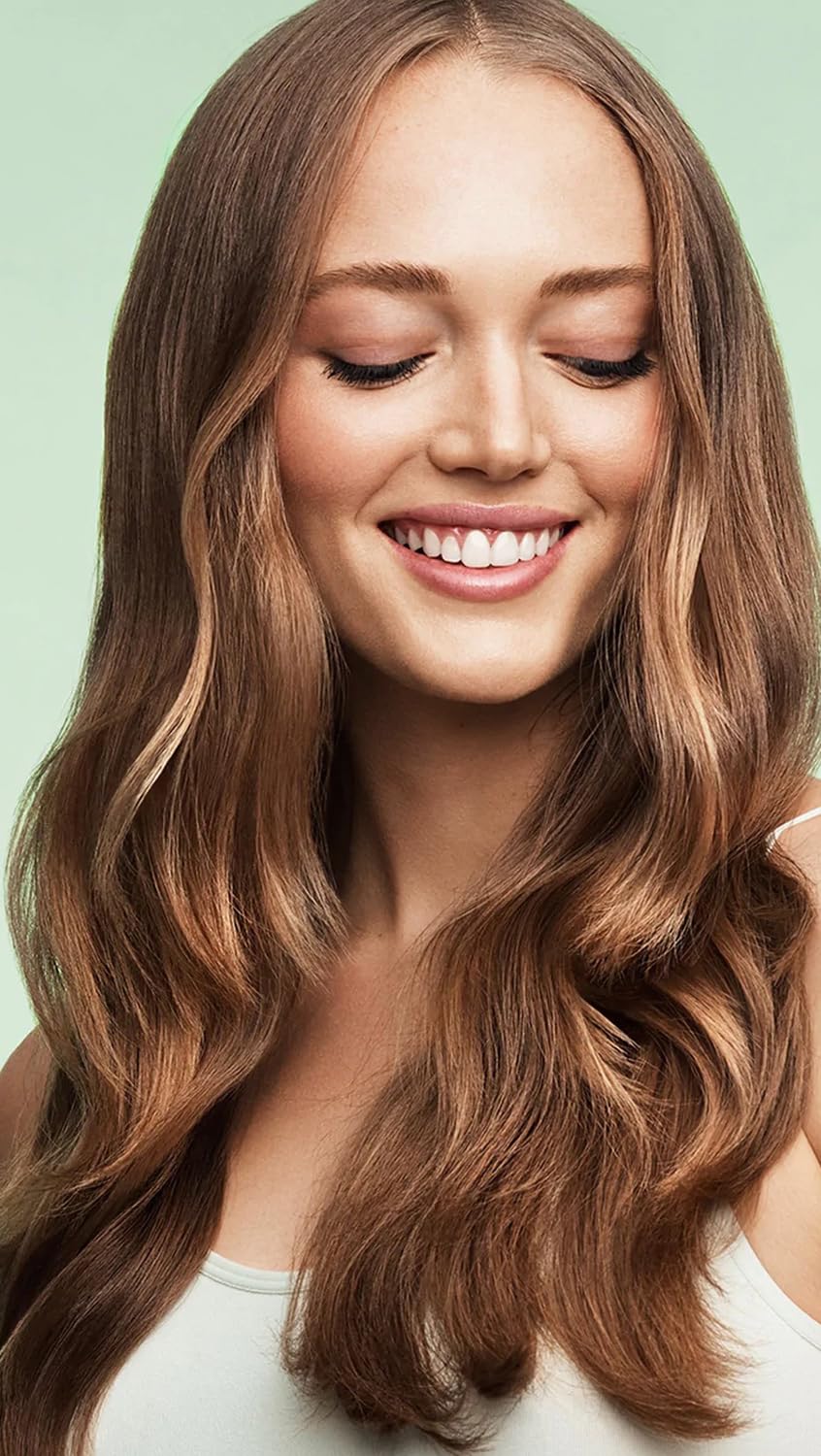 Briogeo Superfoods ingredients bowl featuring greens and fruits for healthy hair support