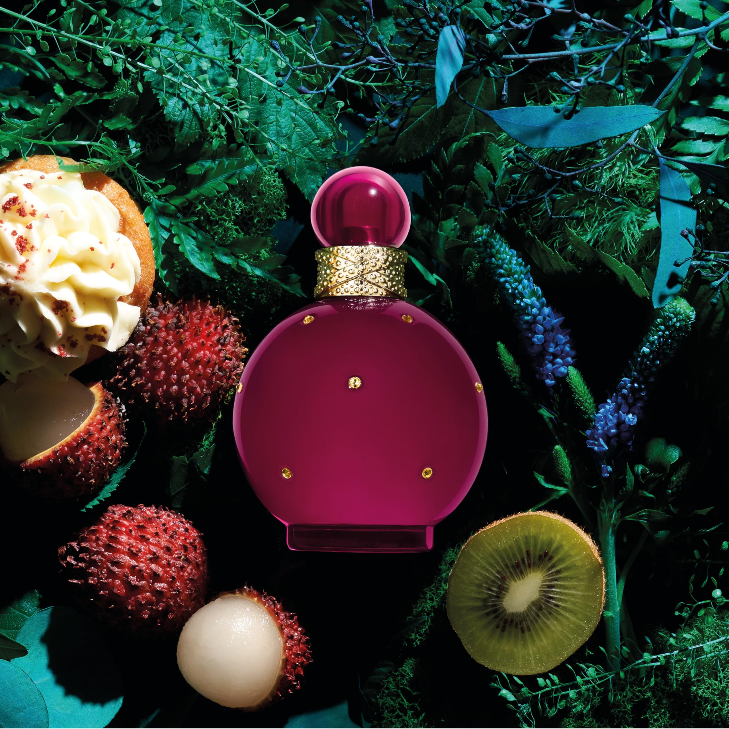 Britney Spears Fantasy Intense pink-tinted bottle signaling luxury mood.