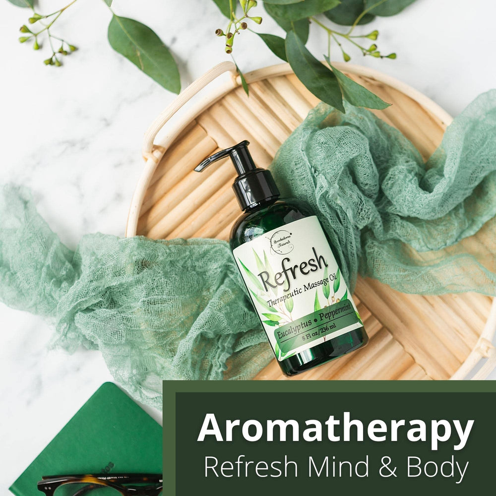 Brookethorne Naturals Refresh Massage Oil near massage tools like handheld massager.