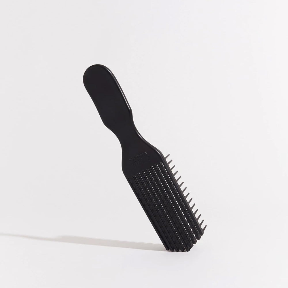 Brush With The Best Detangler Brush in action on curly hair for smoother coils.