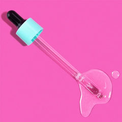 B.TAN Drops bottle close-up emphasizing vegan formula