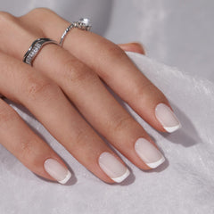BTArtbox white French tip nails on-hand closeup for wedding-ready style.