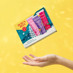 Burt's Bees Wild Rose Berry hand cream tube close-up highlighting nourishing scent.