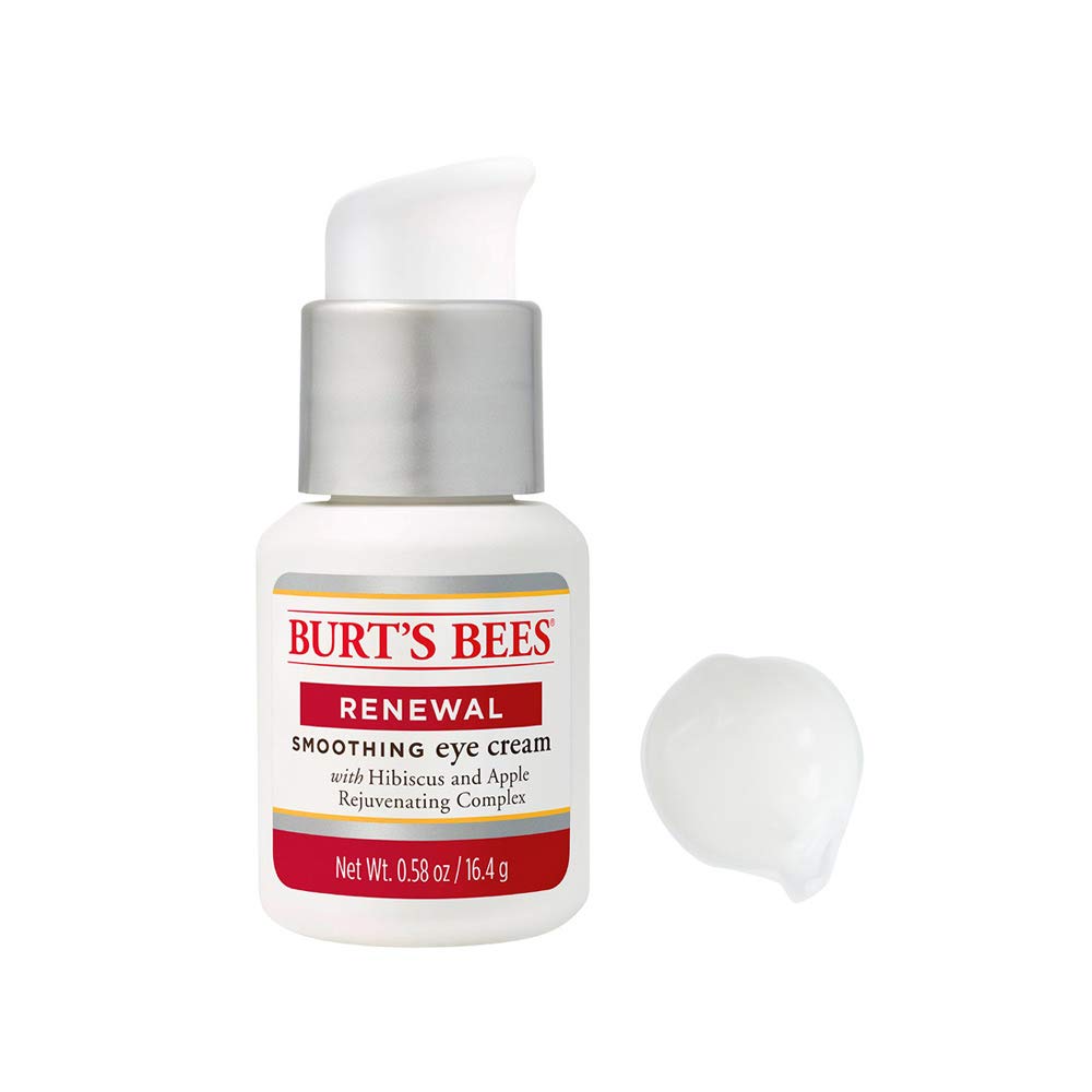 Application shot shows Burt's Bees Renewal Eye Cream smoothing the under-eye area.