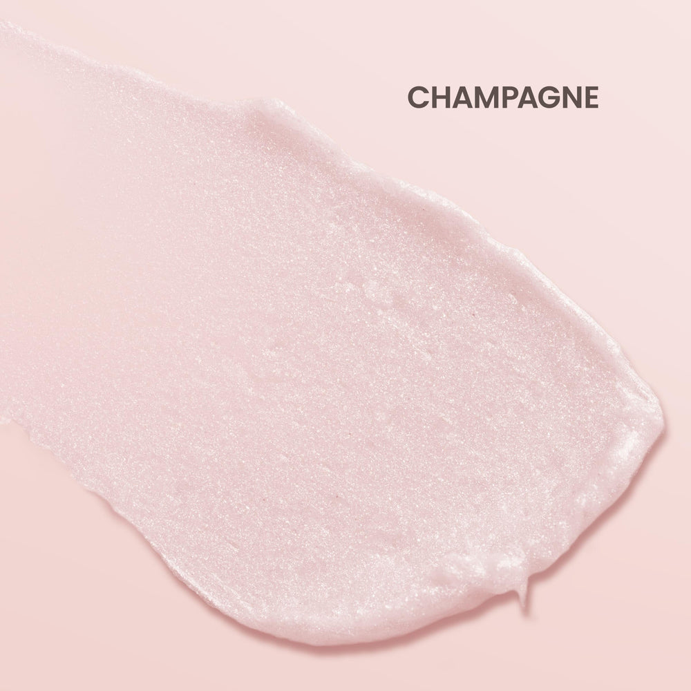 Burt's Bees Shimmer Lip Tint Champagne swatch on skin shows soft glow.