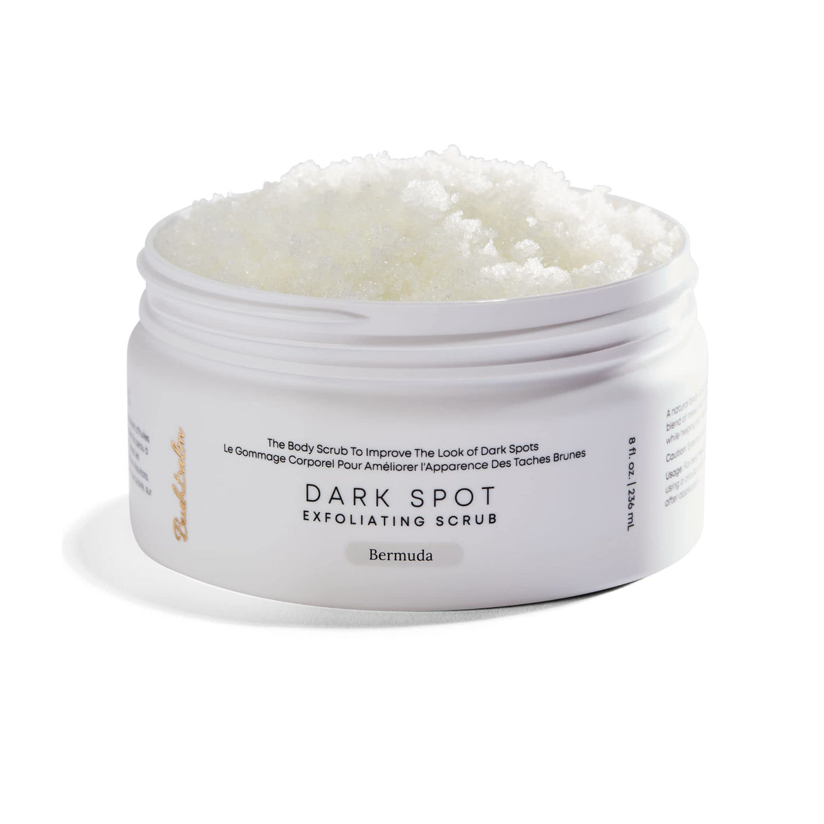 Bushbalm Bermuda dark-spot exfoliating scrub bottle shows pre-shave prep and buffing action.