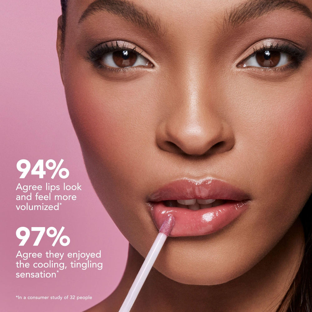 Buxom lip gloss brush applicator detail for precise, comfortable application.