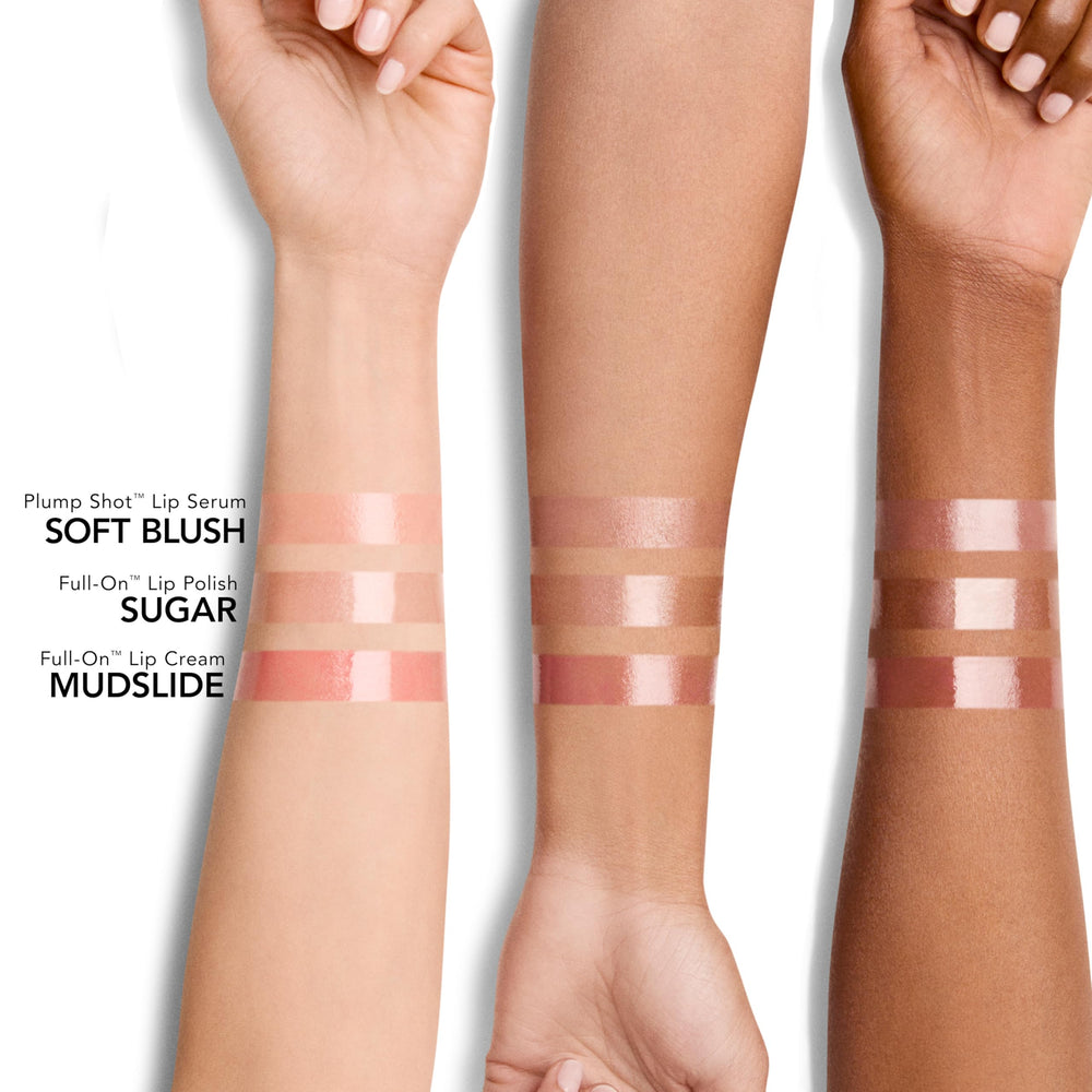 Buxom Mudslide Lip Cream close-up highlighting glassy finish and vibrant pigment.