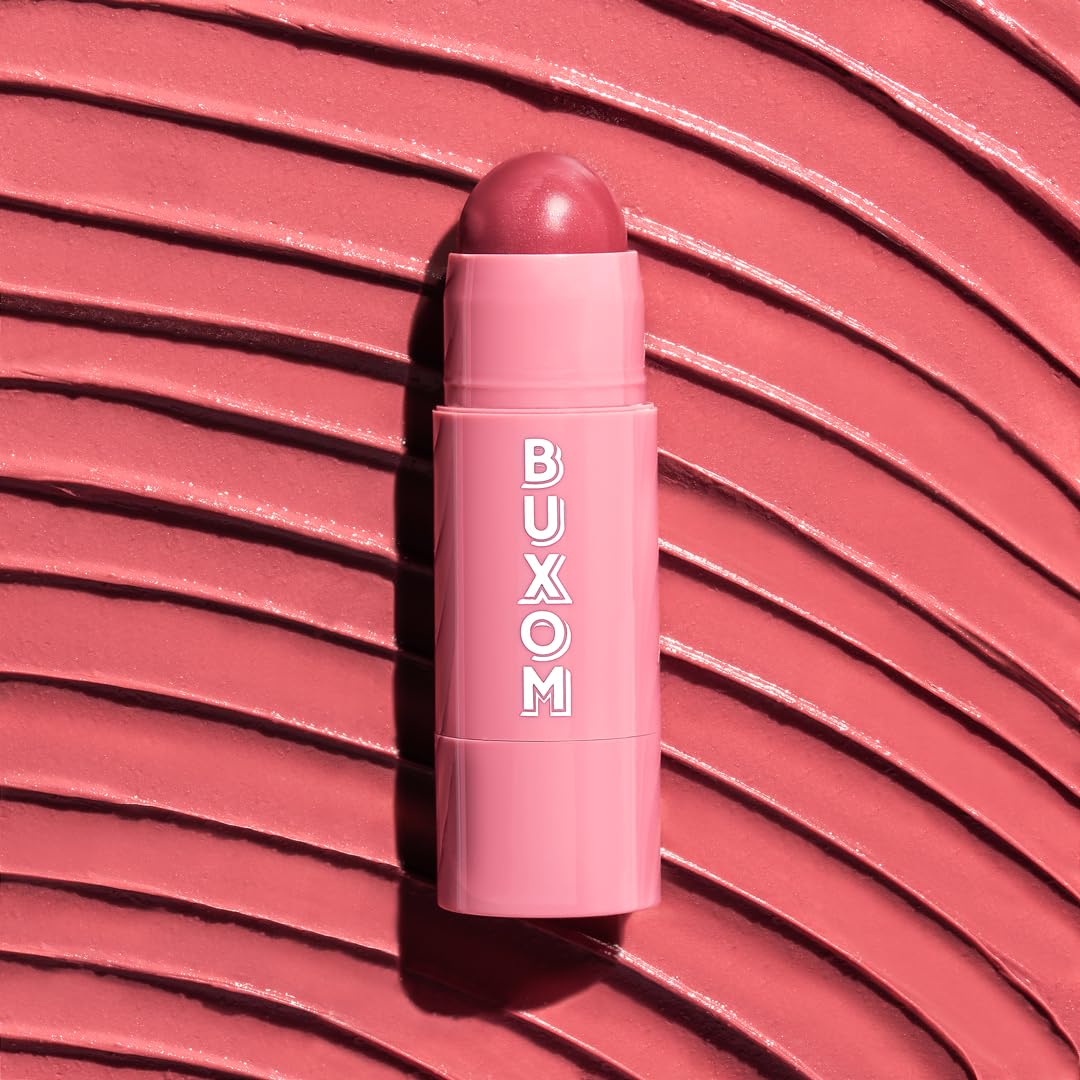 BUXOM Dolly Fever swirled tint on lip illustrates sheer coverage and satin finish.