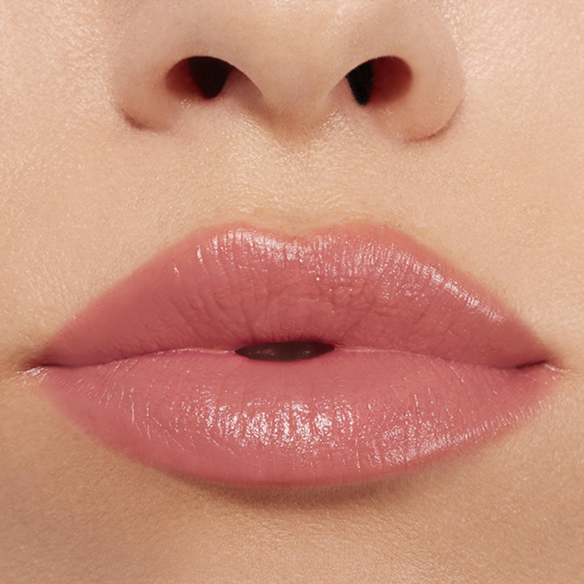 Buxom Power-Full Plumping Lip Balm Inner Glow tube hints at pumpkin seed oil nourishing hydration.