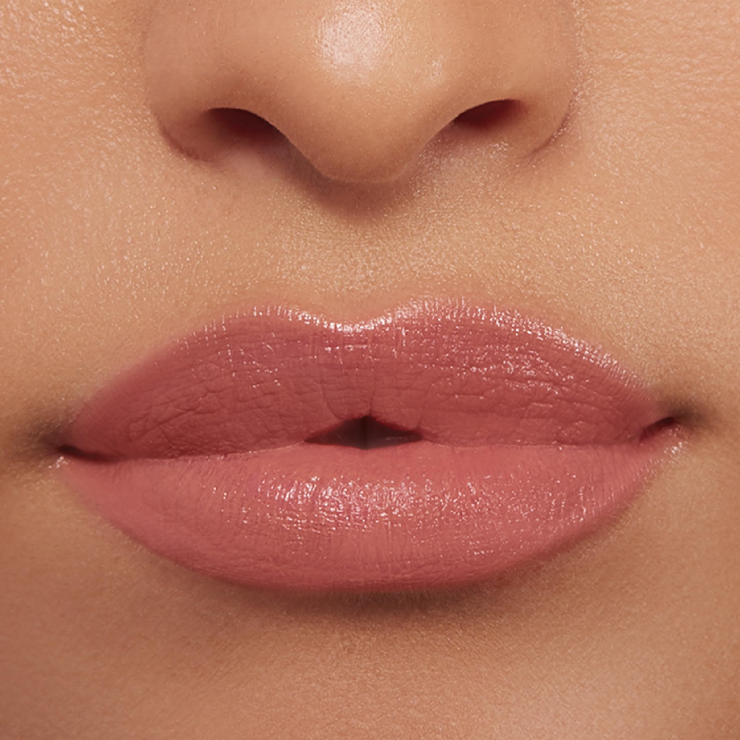 Buxom Power-Full Plumping Lip Balm Inner Glow swatch shows sheer satin finish.