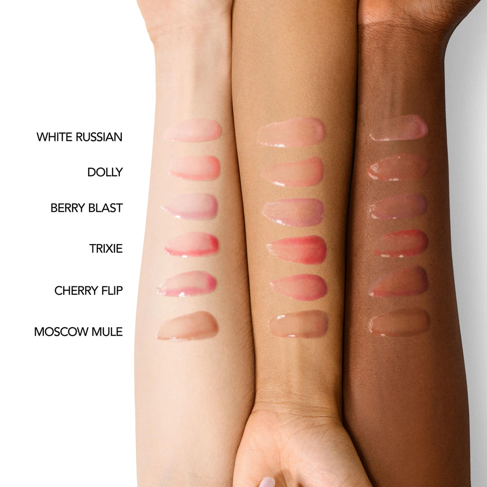 Buxom Trixie lip oil swatch reveals pillowy plump and juicy hydration.