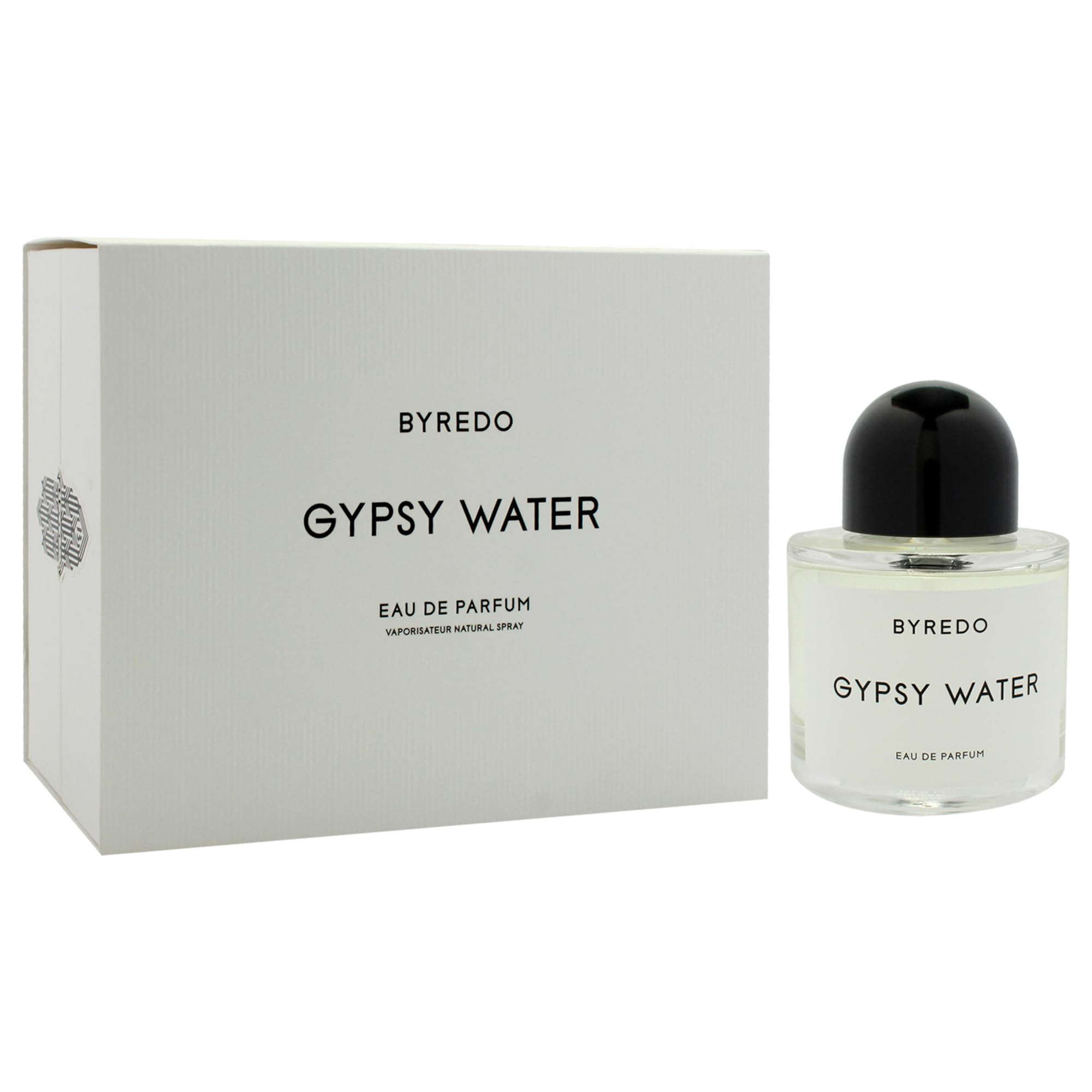 Byredo Gypsy Water bottle on wooden table conveys timeless, versatile scent presence.