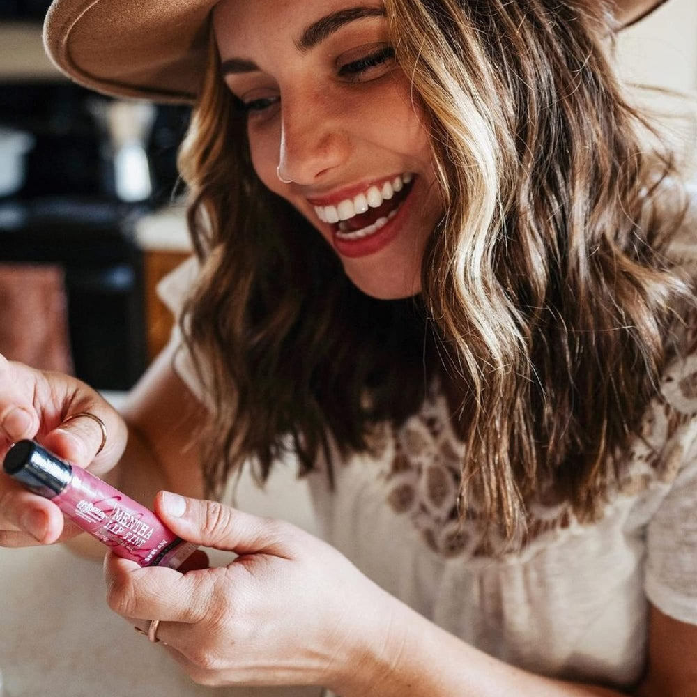C.O. Bigelow bulk lip shine packaging emphasizes travel-ready moisture for day-to-night use.
