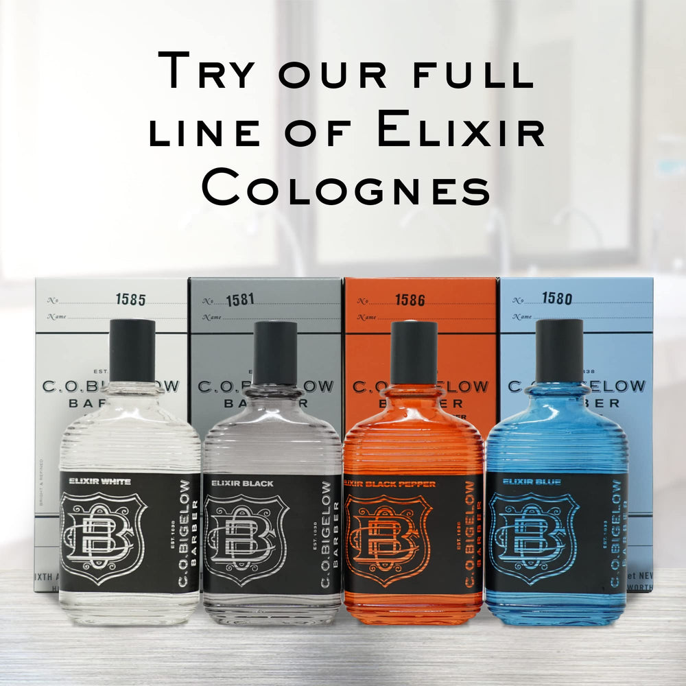 C.O. Bigelow Elixir Blue bottle on wood stand reveals modern masculine finish with woody hints.
