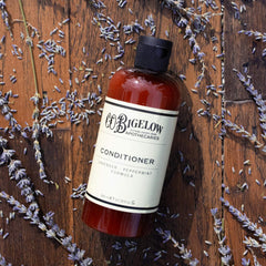 C.O. Bigelow Lavender Peppermint Conditioner dispensed, highlighting easy application and detangling support