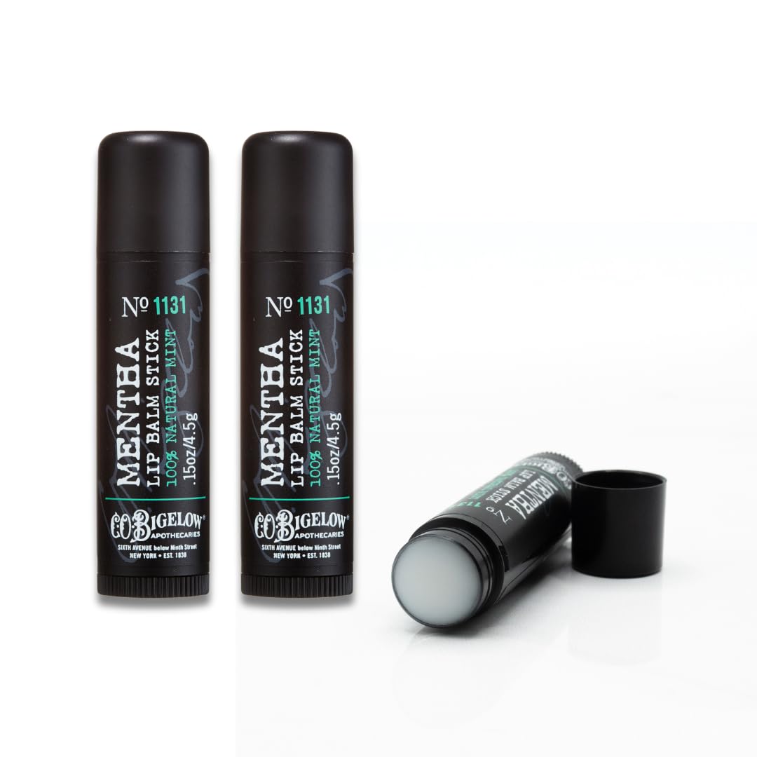 C.O. Bigelow Mentha Lip Balm sits at a desk, ready for hydration in a bag or on the go.