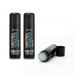 C.O. Bigelow Mentha Lip Balm sits at a desk, ready for hydration in a bag or on the go.
