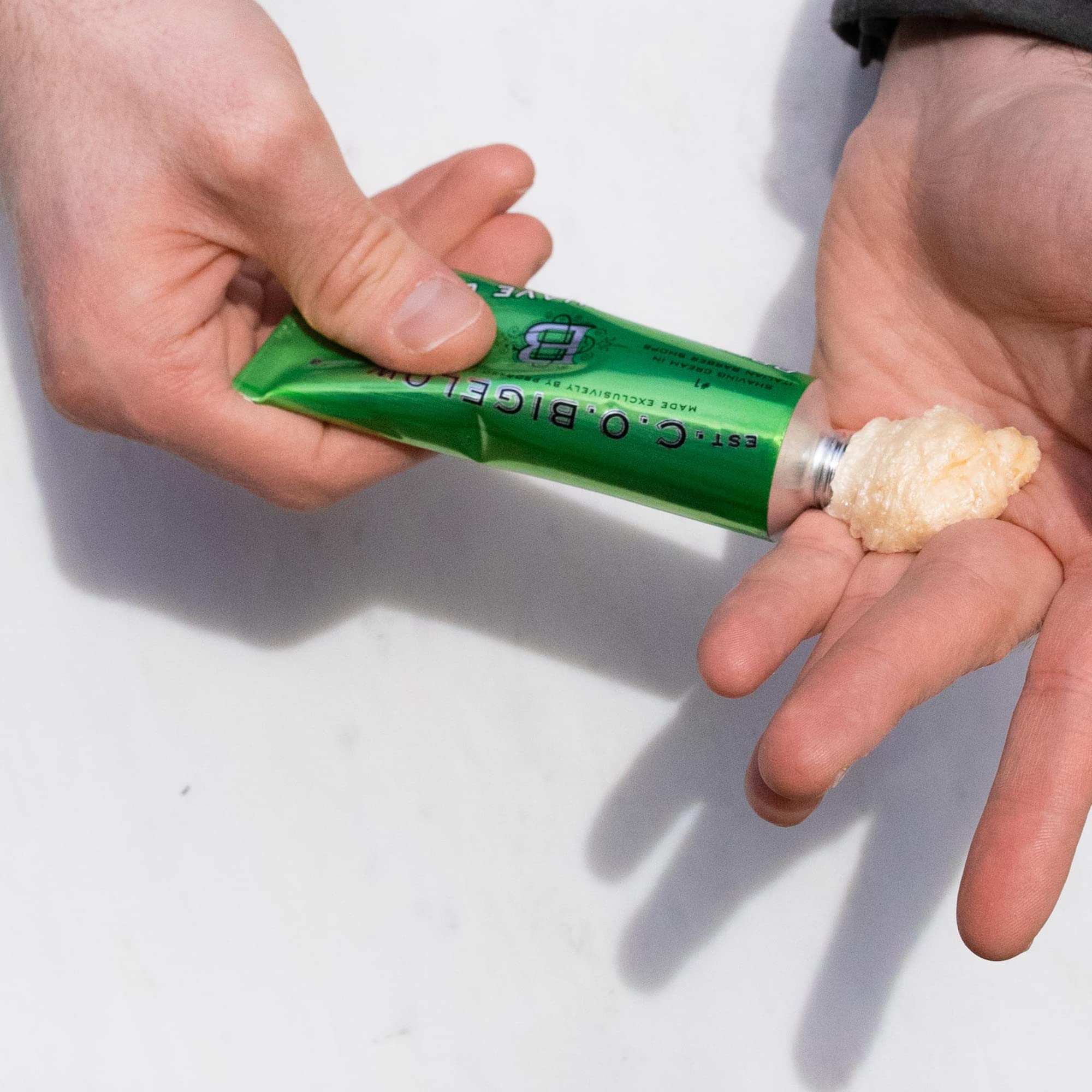 Shaving brush application shows C.O. Bigelow foam builds protective lather.